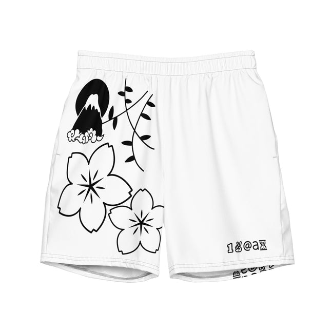 A pair of men's swim trunks with a white background, featuring a black graphic design including a bird, flowers, and the  Peace Artists brand's logo.